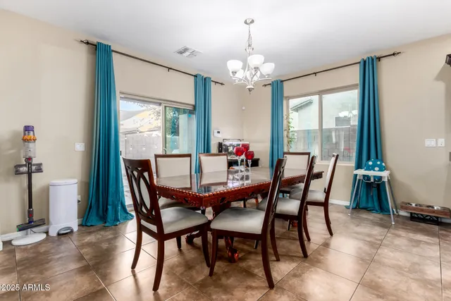 a view of a dining room with furniture window and outside view