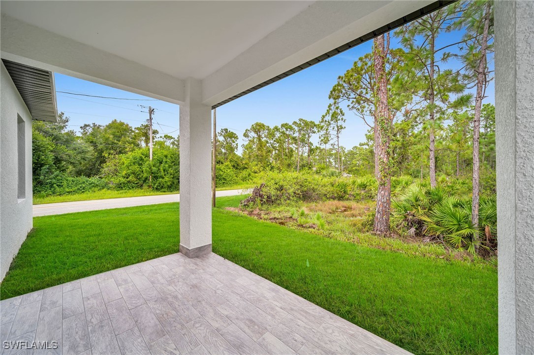 1006 West 10th Street Lehigh Acres, FL 33972 - Photo 26 of 32 a view of back yard from a balcony