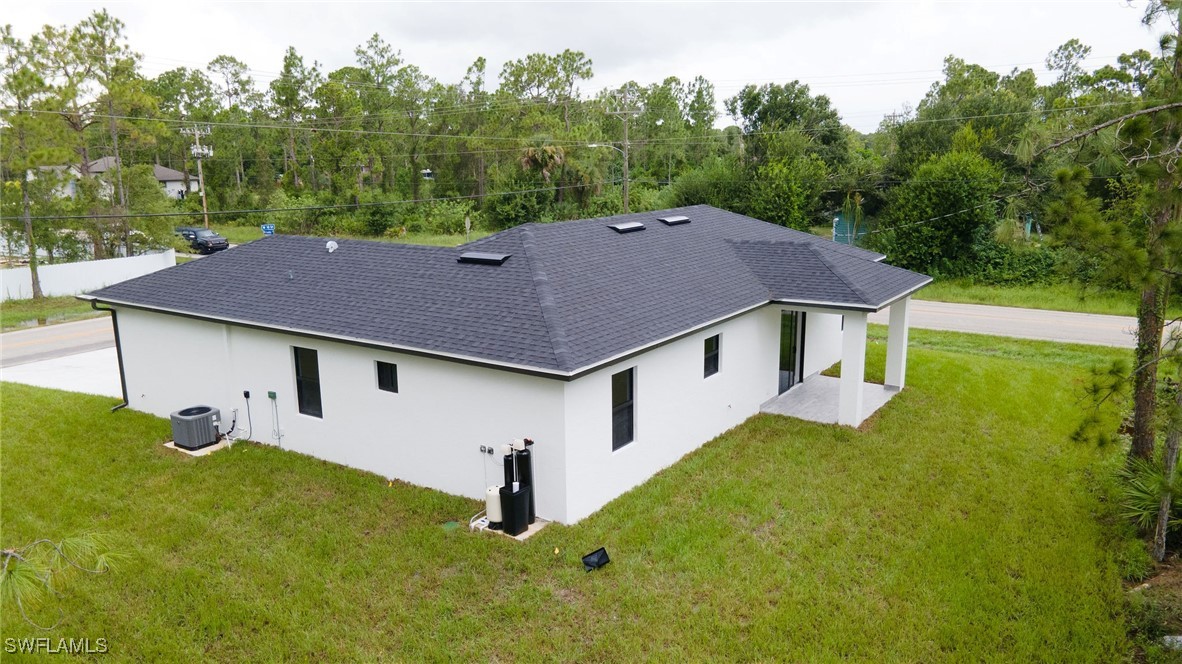 1006 West 10th Street Lehigh Acres, FL 33972 - Photo 29 of 32 a aerial view of a house with table and chairs