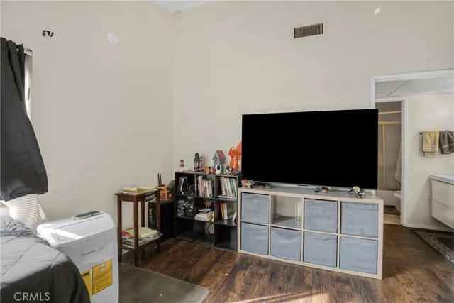 a room with furniture and flat screen tv