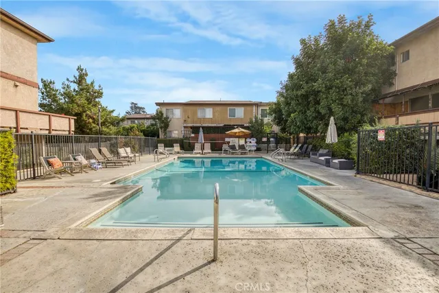 a view of a swimming pool with a patio