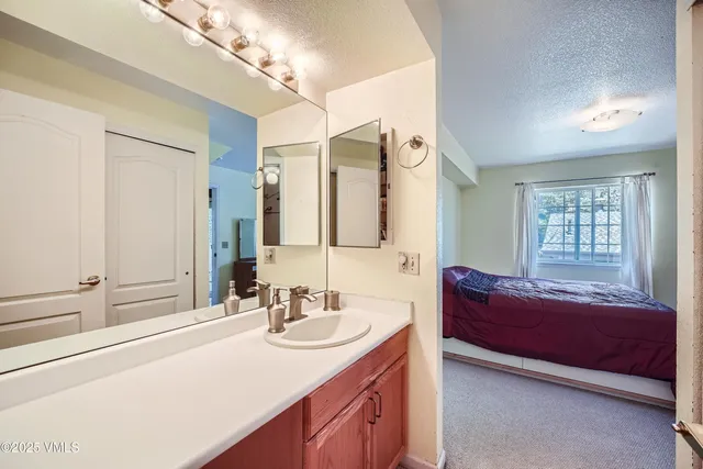 a bathroom with a sink double vanity and a mirror