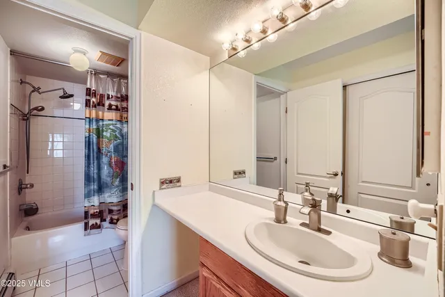 a bathroom with a sink double vanity and a mirror