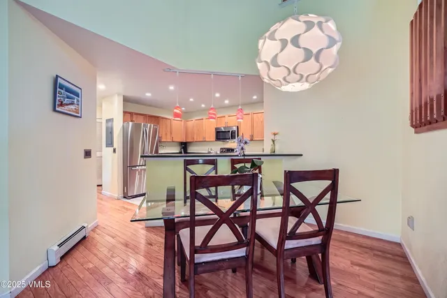 a view of a dining room with furniture and wooden floor