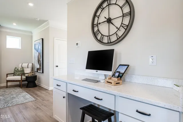 a work room with furniture and a window