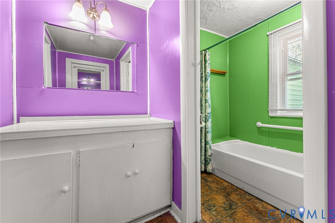 2097 Coles Point Road Hague, VA 22469 - Photo 20 of 34 a bathroom with a sink mirror and a bathtub