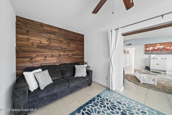 a living room with furniture and a rug