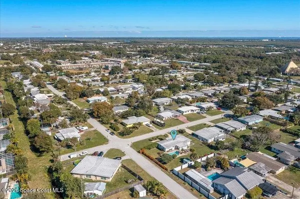 an aerial view of residential building with parking space