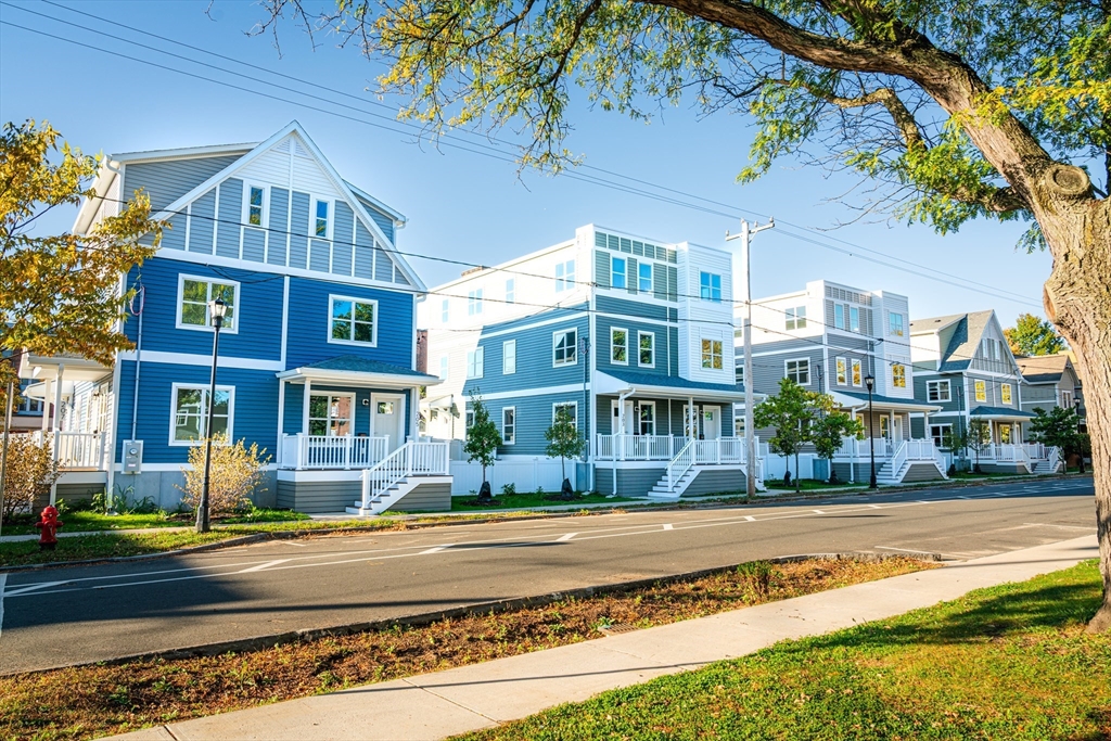 199 Clemente Street Holyoke, MA 01040 - Photo 12 of 16 a front view of residential houses with yard