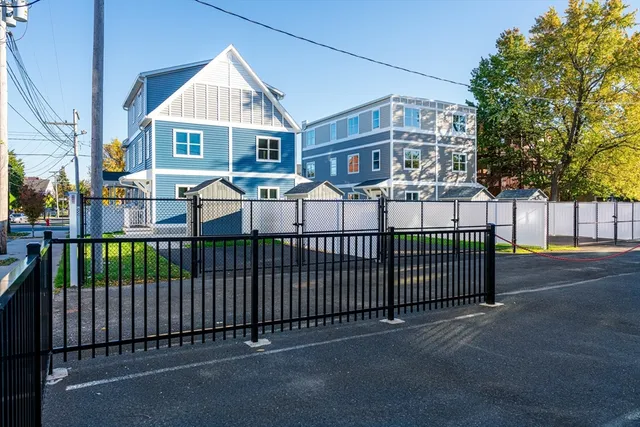 a view of a white house with a large windows