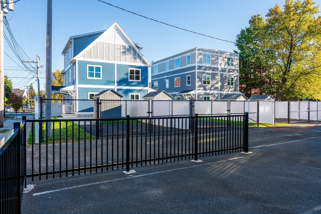 199 Clemente Street Holyoke, MA 01040 - Photo 14 of 16 a view of a white house with a large windows