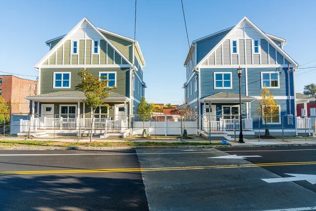 a front view of a residential houses with street