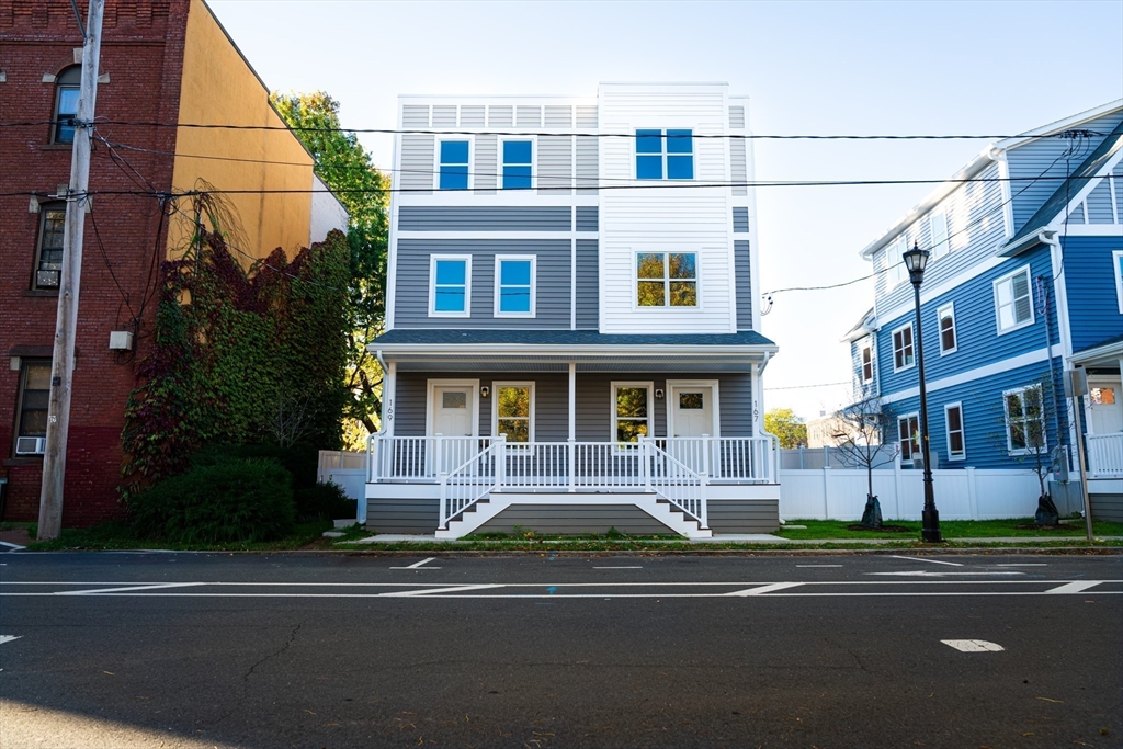 199 Clemente Street Holyoke, MA 01040 - Photo 2 of 16 a building that has a lots of windows on it