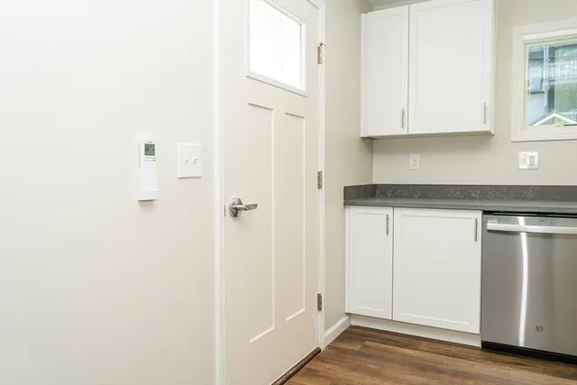 a view of cabinets and wooden floor
