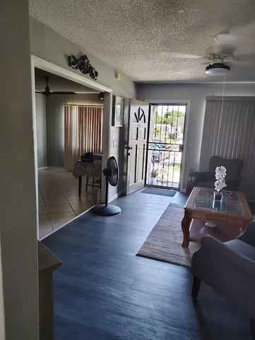 a living room with furniture and a window