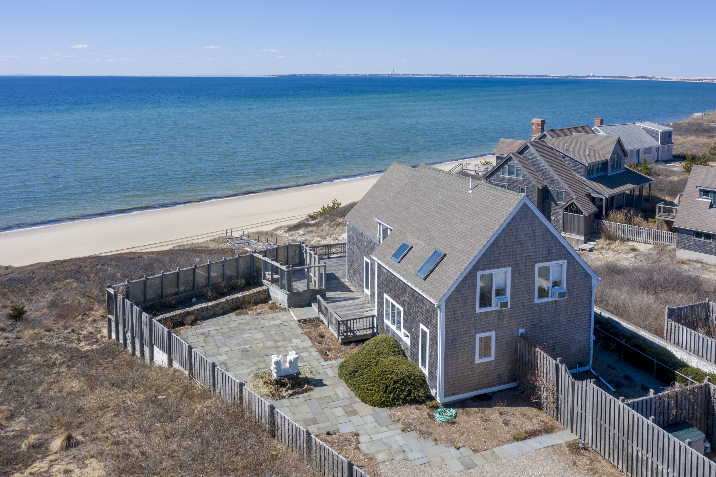 17 Bay View Road Truro, MA 02666 - Photo 1 of 40 an aerial view of a house with a ocean view
