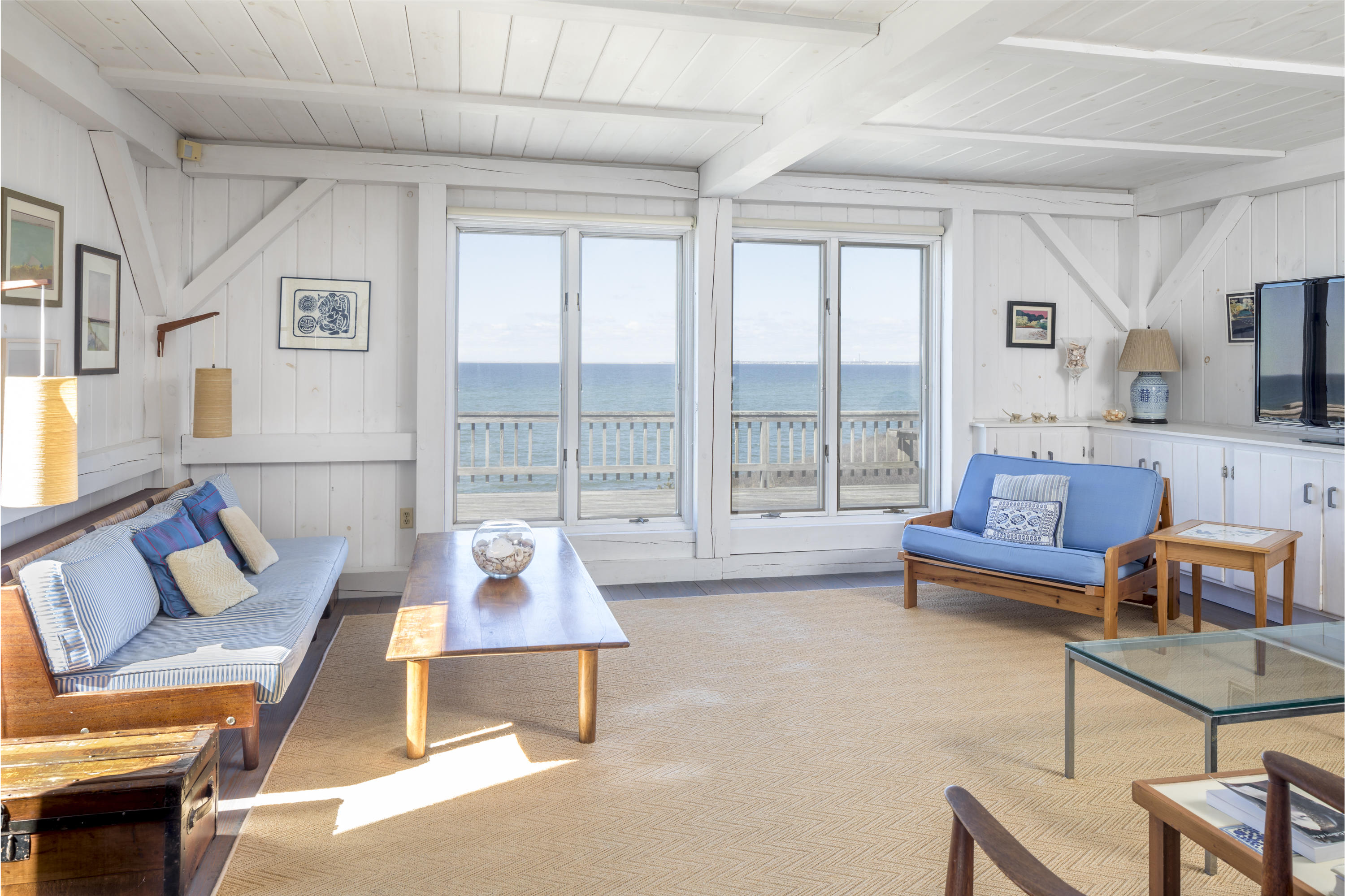 17 Bay View Road Truro, MA 02666 - Photo 11 of 40 a living room with furniture and a large window