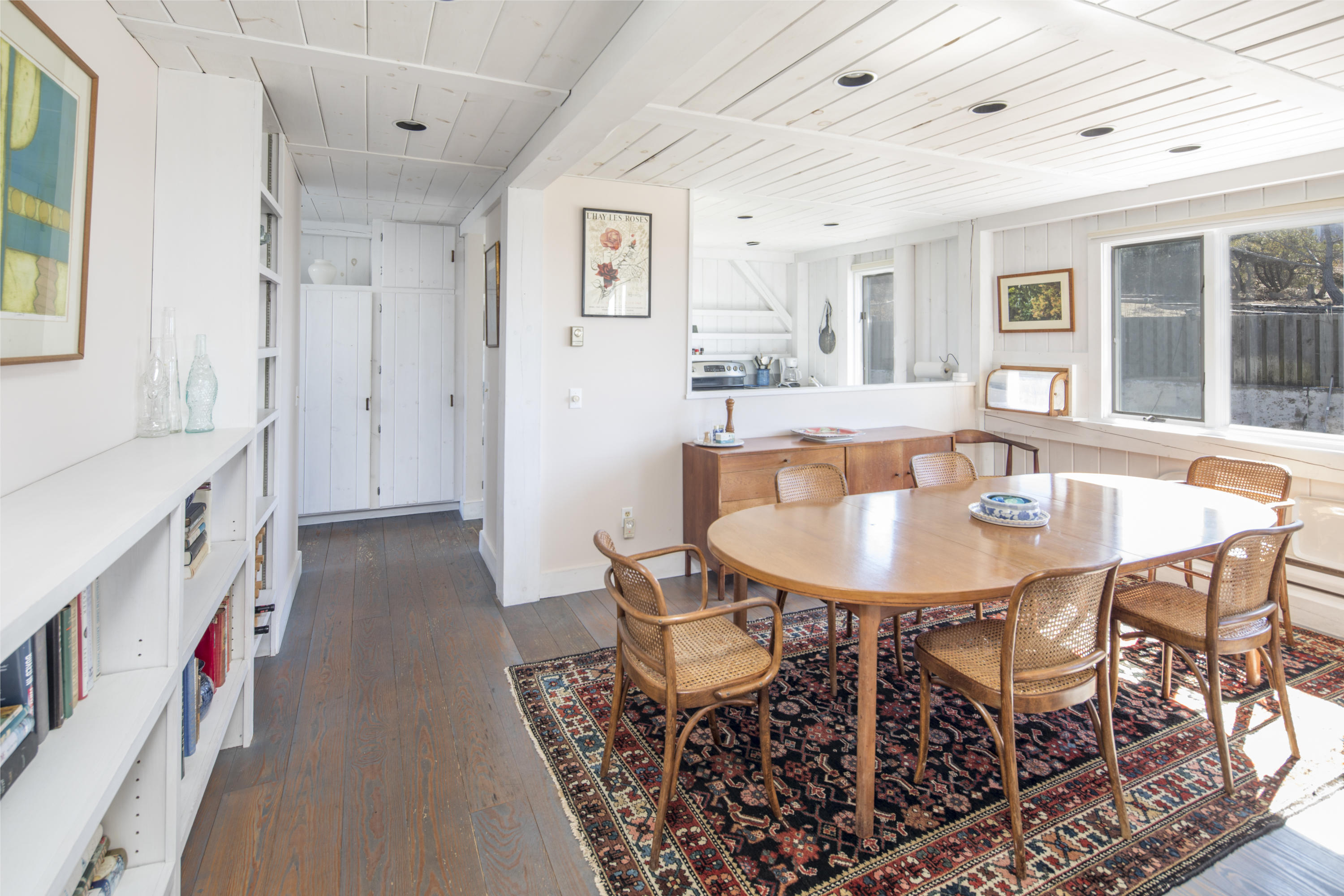 17 Bay View Road Truro, MA 02666 - Photo 12 of 40 a dining room with stainless steel appliances a table and chairs