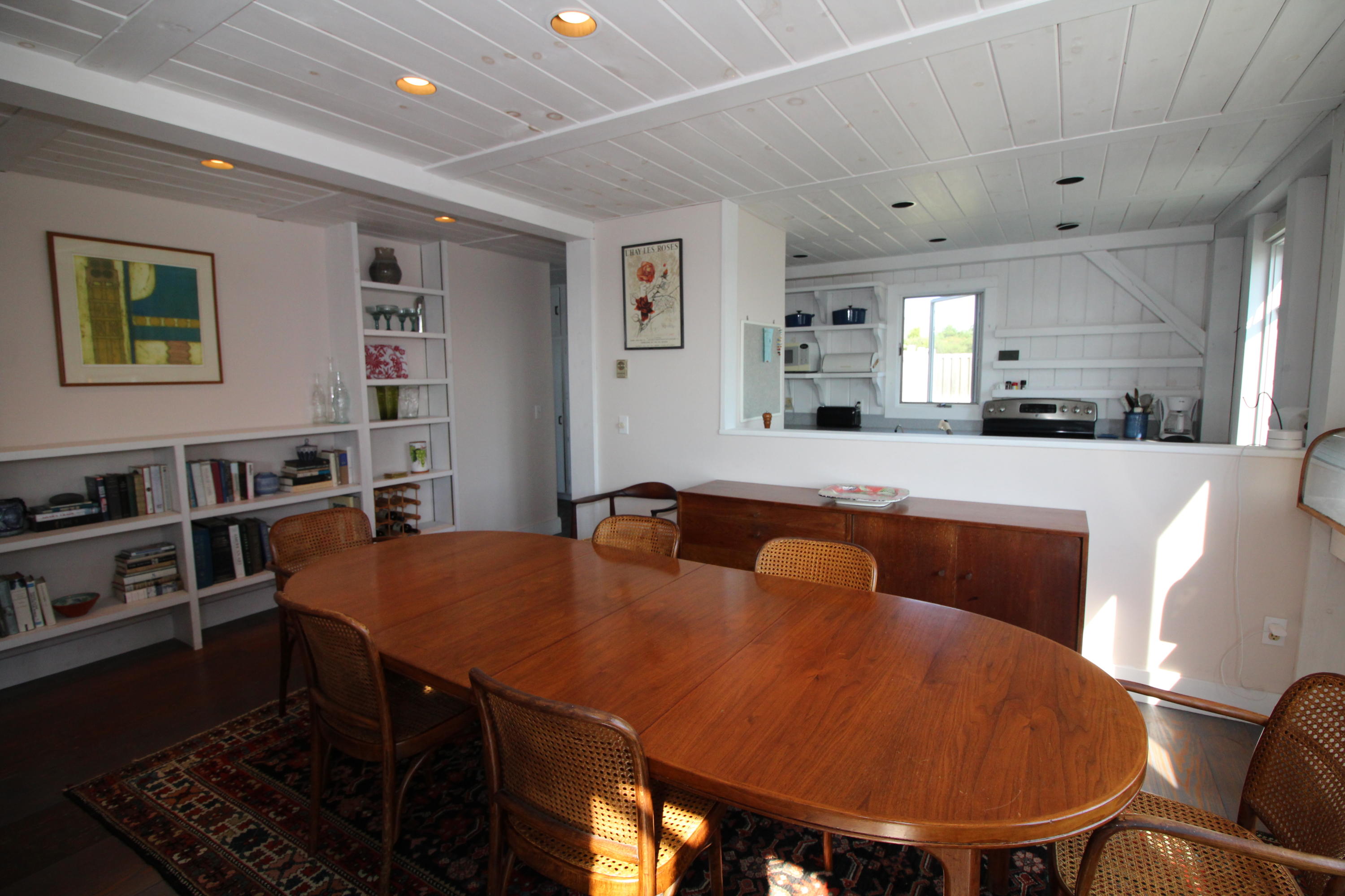 17 Bay View Road Truro, MA 02666 - Photo 13 of 40 a large kitchen with stainless steel appliances a stove a table and chairs
