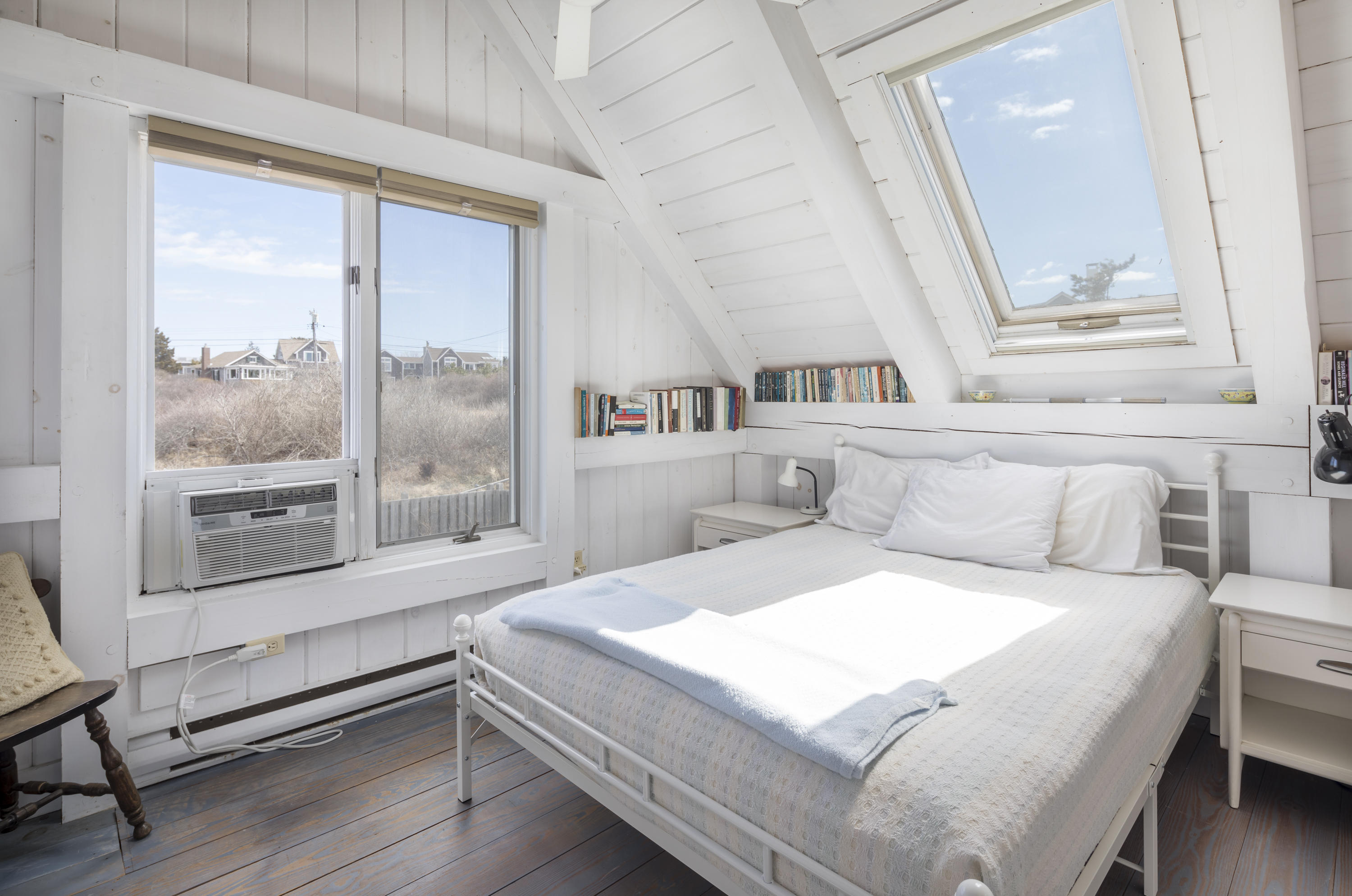 17 Bay View Road Truro, MA 02666 - Photo 17 of 40 a bedroom with a bed and a large window with outer view