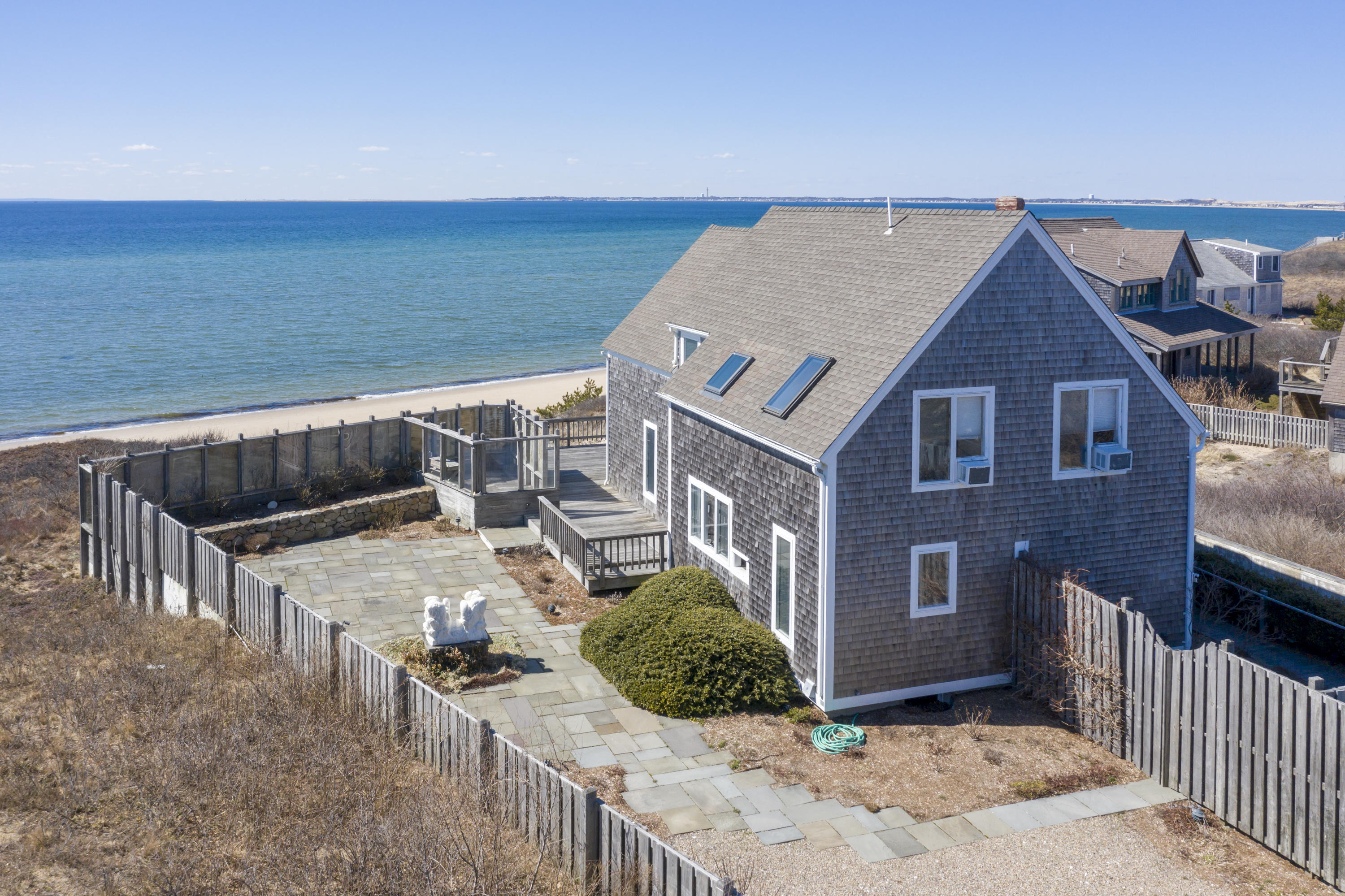 17 Bay View Road Truro, MA 02666 - Photo 32 of 40 a view of a house with backyard and sitting area