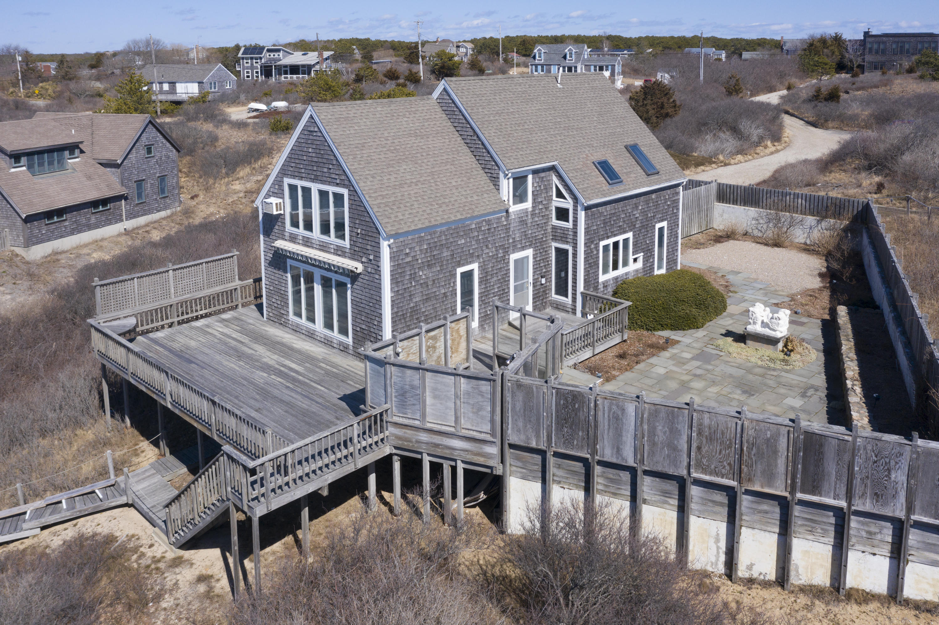 17 Bay View Road Truro, MA 02666 - Photo 35 of 40 a view of a patio with a table and chairs