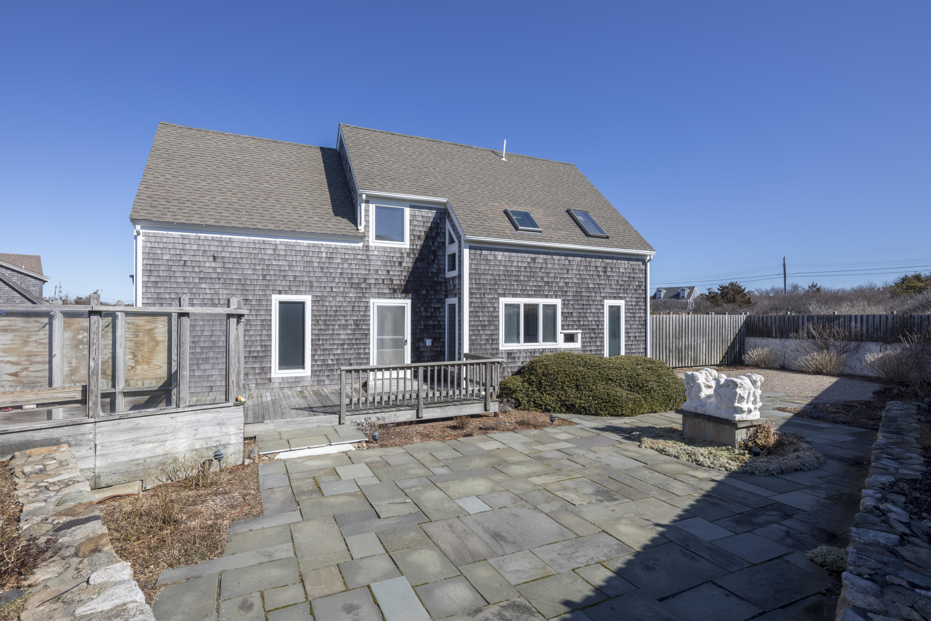 17 Bay View Road Truro, MA 02666 - Photo 6 of 40 a front view of a house with a yard
