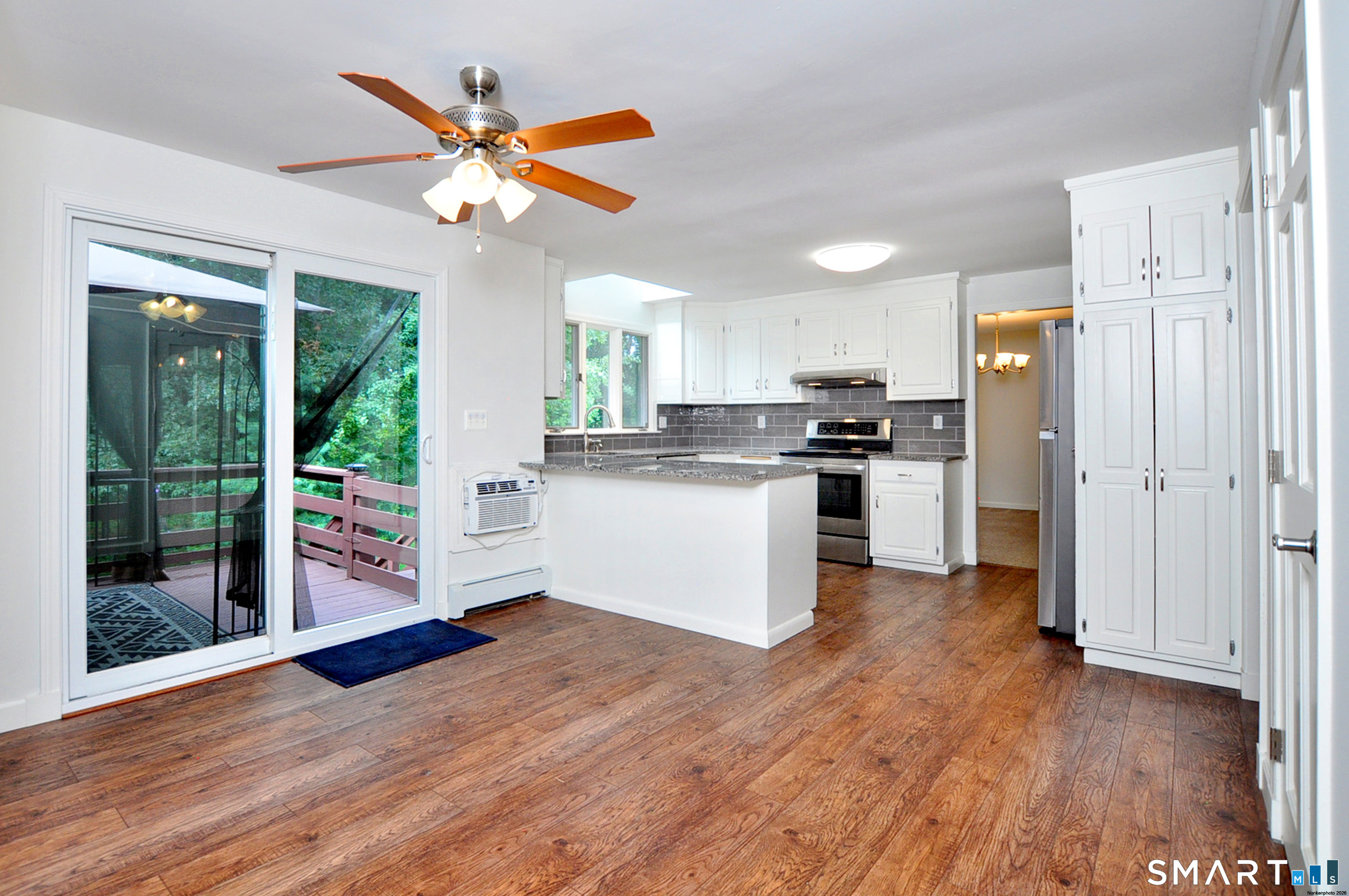 117 Hollow Brook Road Windsor, CT 06095 - Photo 10 of 40 Remodeled Kitchen with sliders to the deck