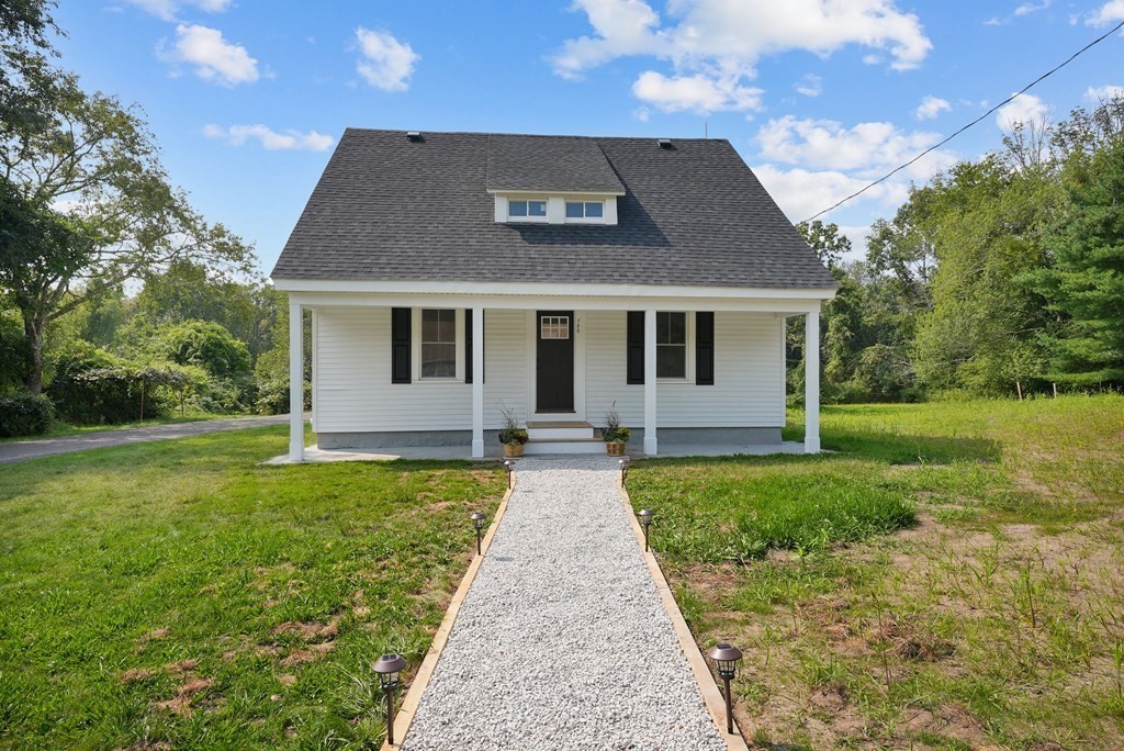 front view of a house with a yard