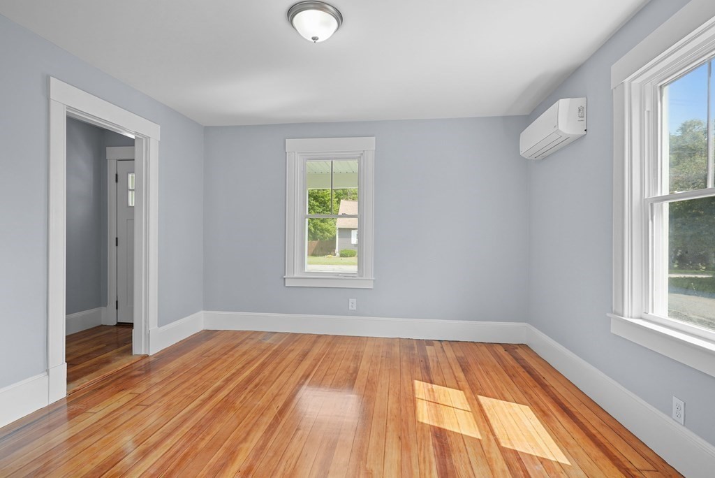 780 Williams Street Dighton, MA 02764 - Photo 14 of 39 an empty room with wooden floor and windows