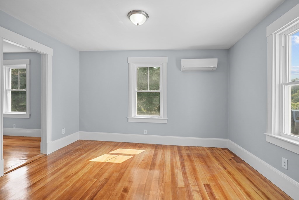780 Williams Street Dighton, MA 02764 - Photo 16 of 39 an empty room with wooden floor and windows