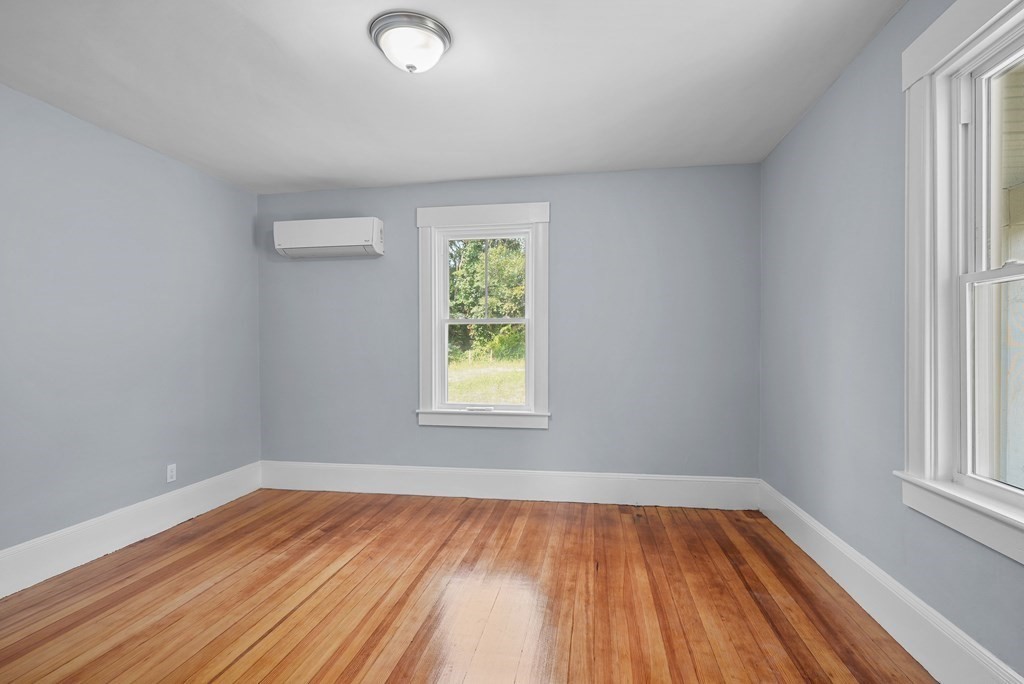 780 Williams Street Dighton, MA 02764 - Photo 18 of 39 wooden floor in an empty room with a window