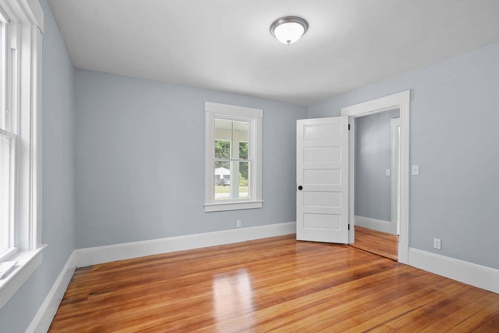780 Williams Street Dighton, MA 02764 - Photo 19 of 39 an empty room with wooden floor and windows