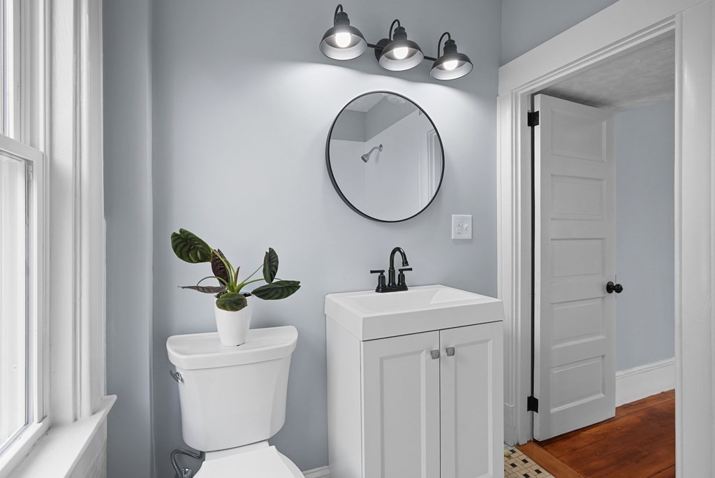 780 Williams Street Dighton, MA 02764 - Photo 22 of 39 a bathroom with a toilet sink and mirror