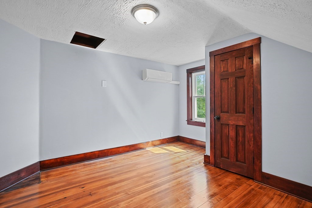 780 Williams Street Dighton, MA 02764 - Photo 25 of 39 an empty room with wooden floor and windows