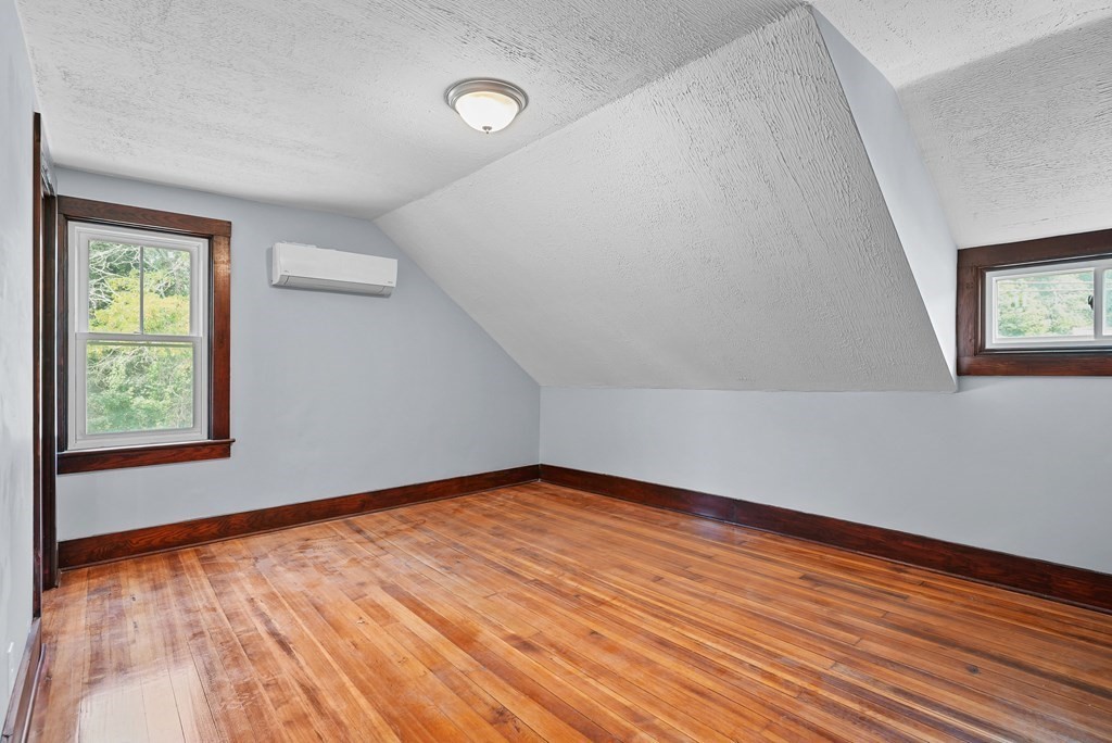 780 Williams Street Dighton, MA 02764 - Photo 27 of 39 a view of an empty room with wooden floor and a window