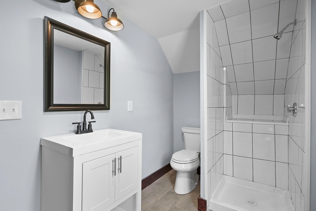 780 Williams Street Dighton, MA 02764 - Photo 33 of 39 a bathroom with a toilet sink and mirror