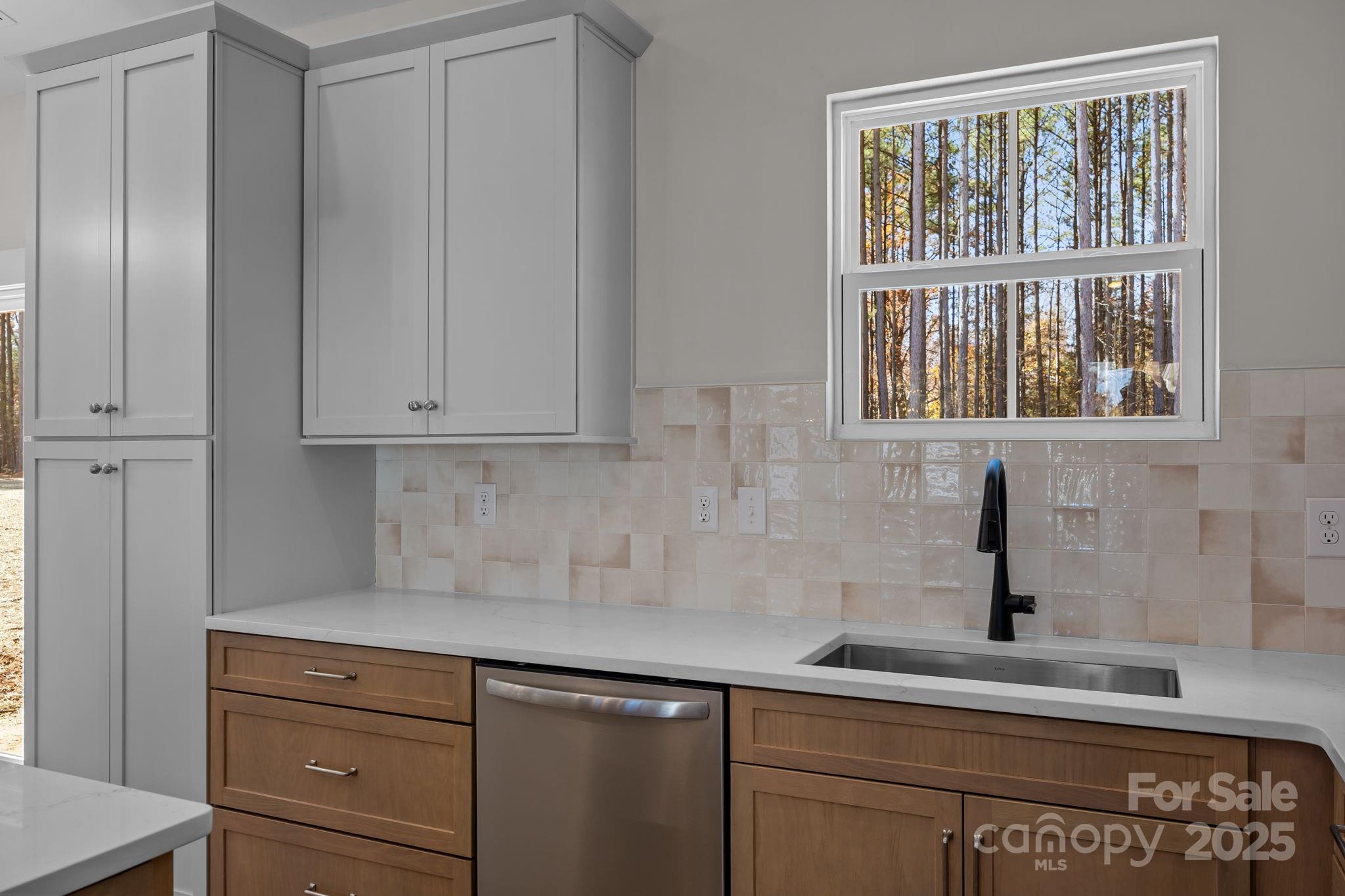 2307 Lee Lawing Road Lincolnton, NC 28092 - Photo 19 of 40 a kitchen with a sink and cabinets