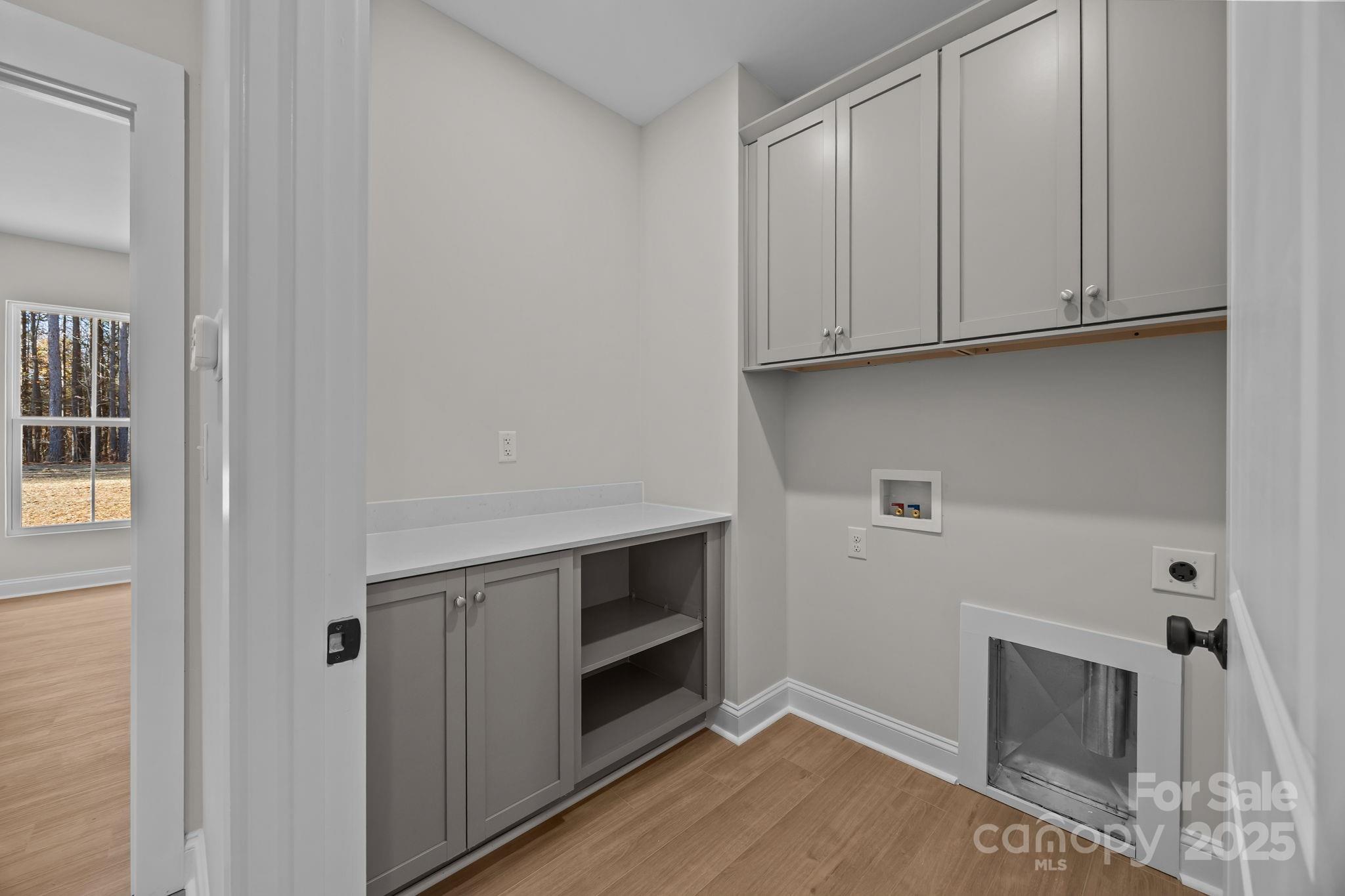 2307 Lee Lawing Road Lincolnton, NC 28092 - Photo 21 of 40 a room with a fireplace and cabinets