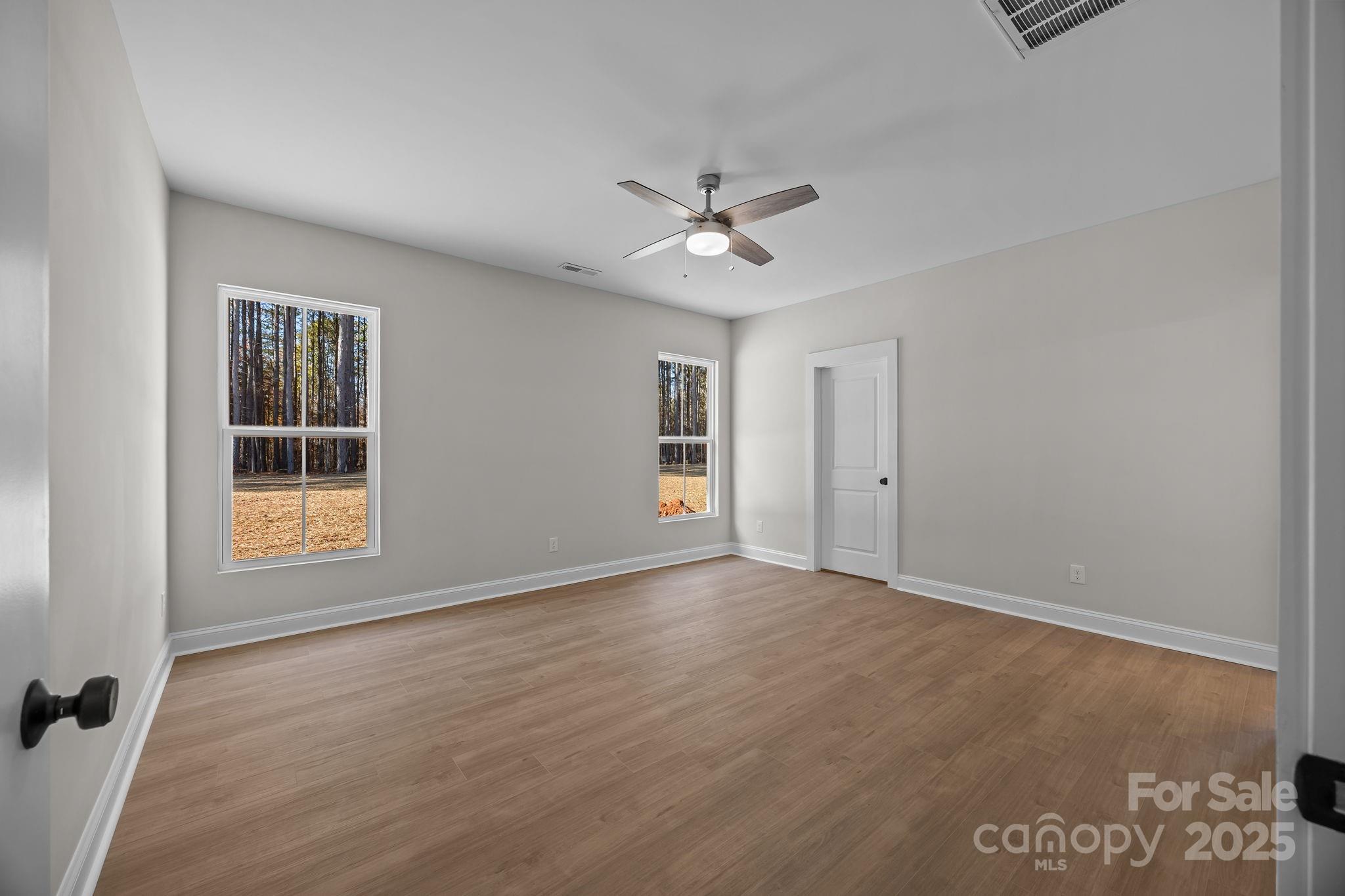 2307 Lee Lawing Road Lincolnton, NC 28092 - Photo 22 of 40 wooden floor in an empty room with a window
