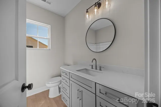 a white bath tub sitting next to a shower