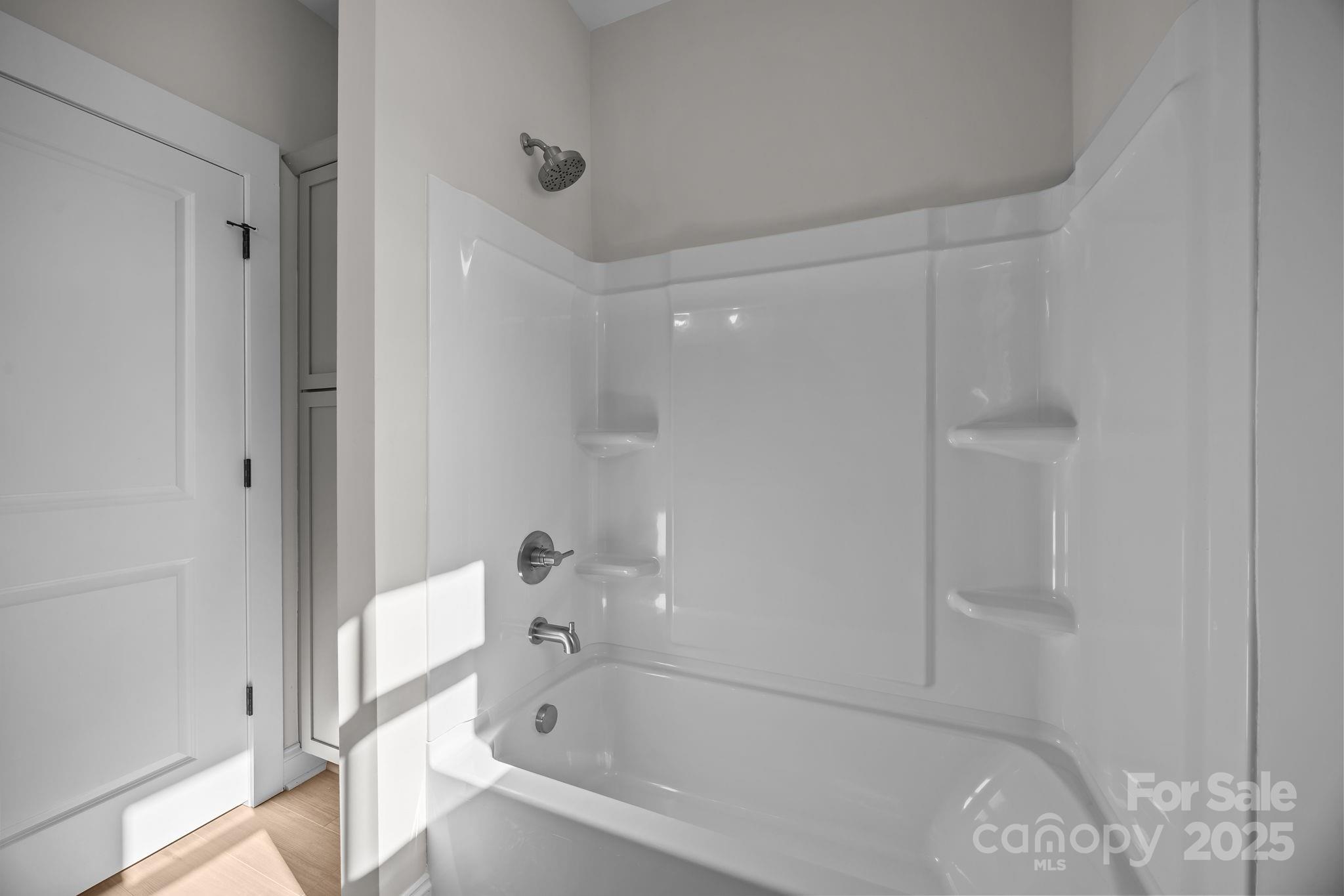 2307 Lee Lawing Road Lincolnton, NC 28092 - Photo 29 of 40 a white bath tub sitting next to a shower