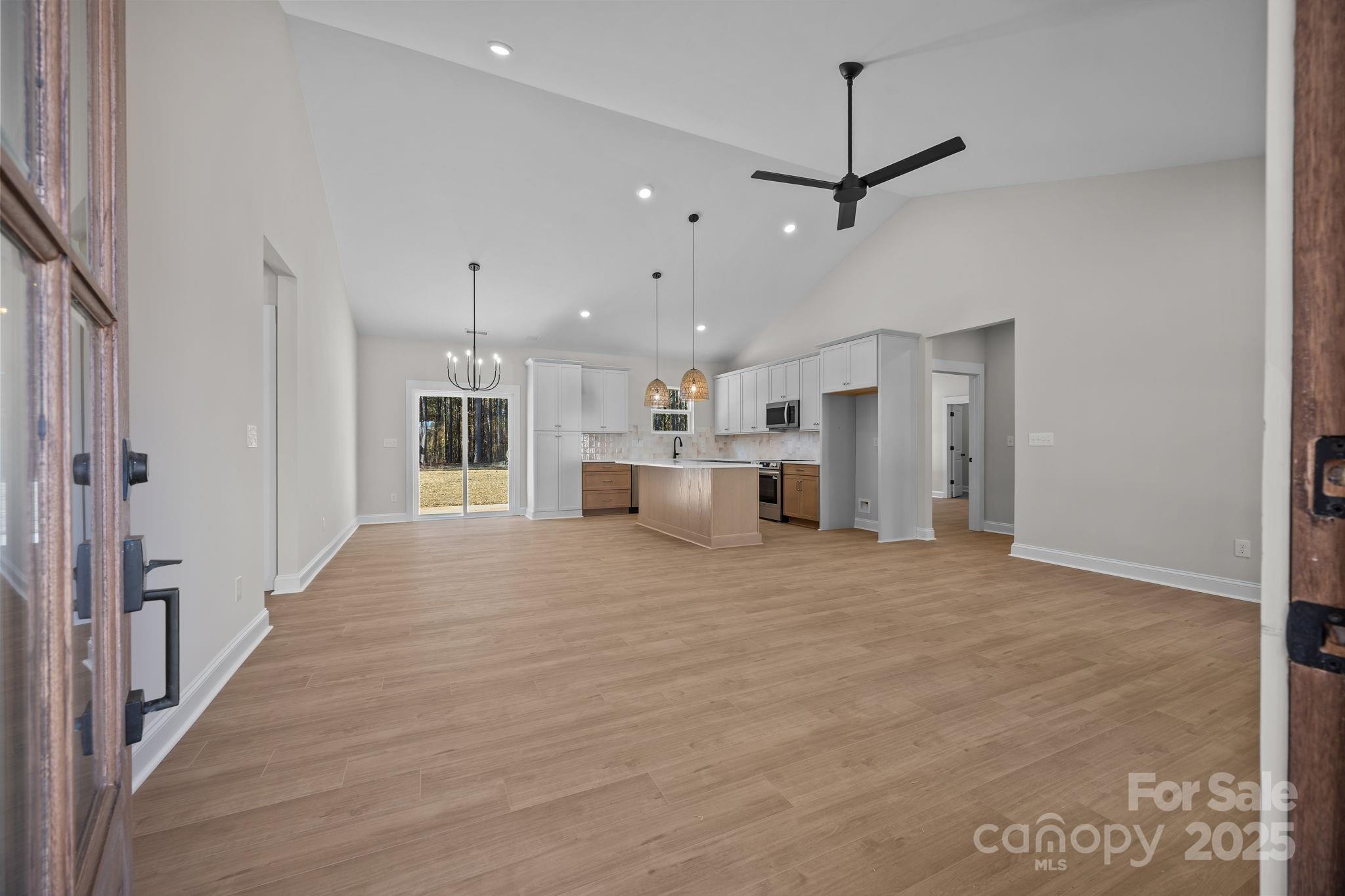 2307 Lee Lawing Road Lincolnton, NC 28092 - Photo 7 of 40 a view of a kitchen with a sink and refrigerator