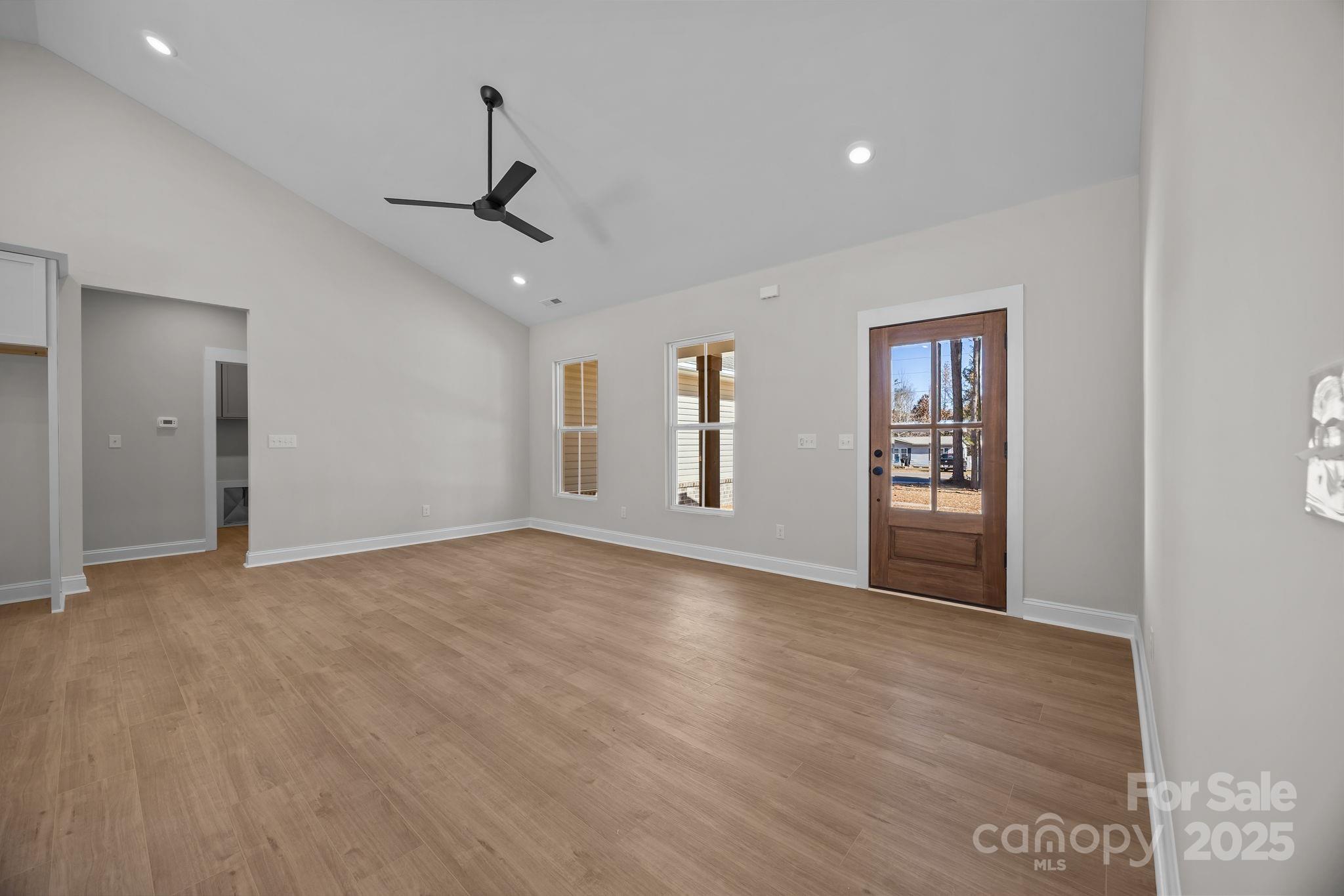 2307 Lee Lawing Road Lincolnton, NC 28092 - Photo 9 of 40 a view of an empty room with a window and wooden floor