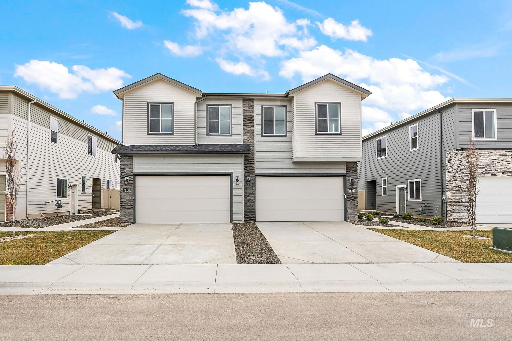 350 North Lagrasse Lane Star, ID 83669 - Photo 1 of 1 View of front facade with stone siding, a garage, and driveway