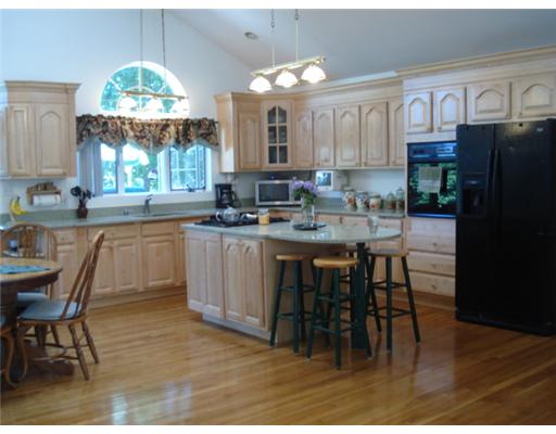 615 Camp Dixie Road Burrillville, RI 02859 - Photo 6 of 13 Kitchen. Spacious brand new fully applianced kitchen includes: center island with cooktop, built-in wall oven, refrigerator, custom cabinetry, vaulted ceiling, skylights, and gleaming hardwood floors!