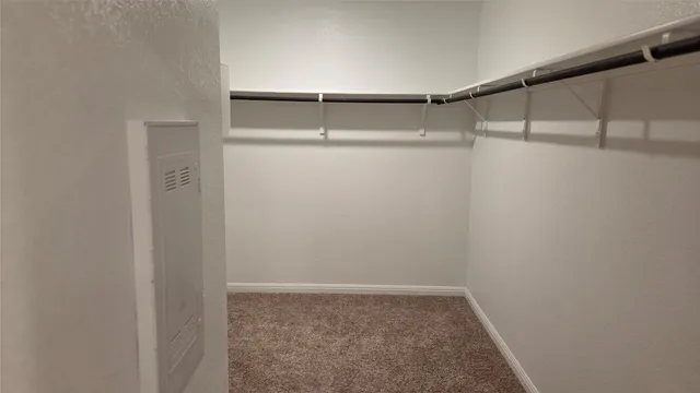 a view of an empty walk in closet