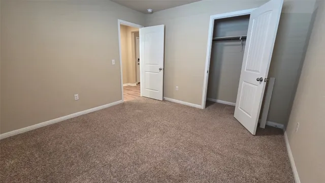 wooden floor and closet in a room