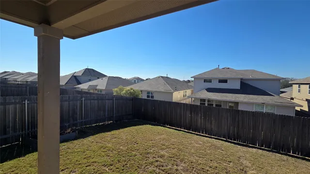 a view of a terrace with a wooden fence