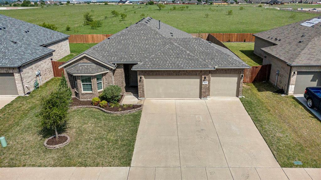 1822 Millbrae Road Cleburne, TX 76033 - Photo 1 of 1 a front view of a house with garden